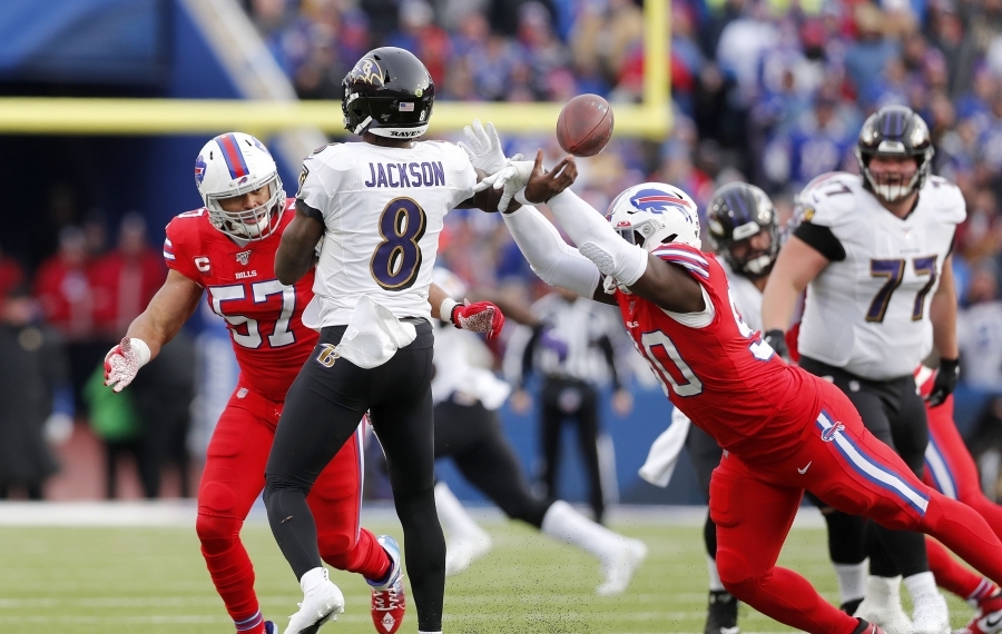 Bills defense pressuring Lamar Jackson.