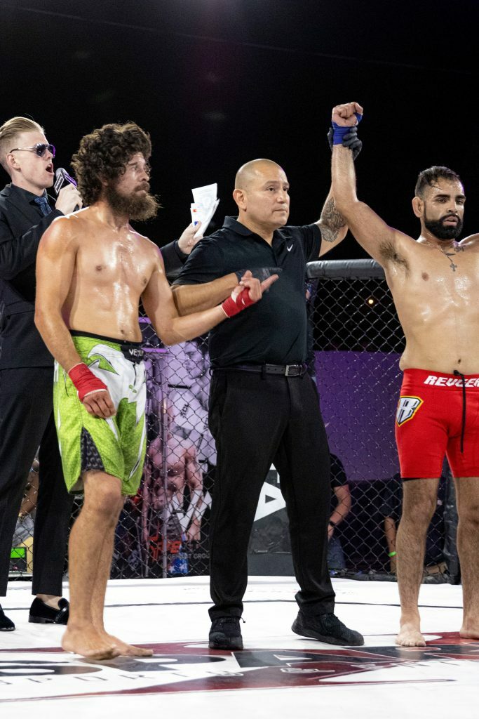 Andy Perez getting his hand raised at Sparta BKMMA. Photo credit Ashlee Moreno.