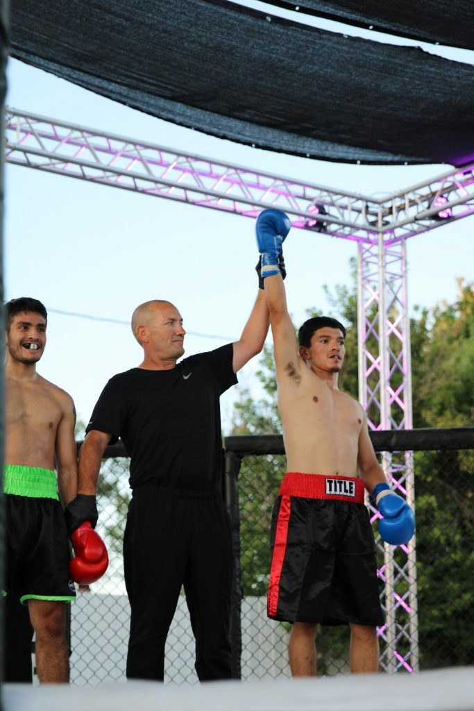 Tomas Ornelas getting his hand raised. Photo credit Ashlee Moreno.