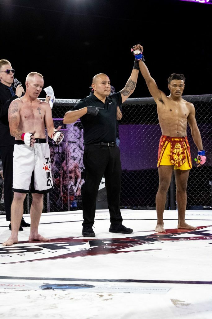 Namir Singleton getting his hand raised. Photo credit Ashlee Moreno.