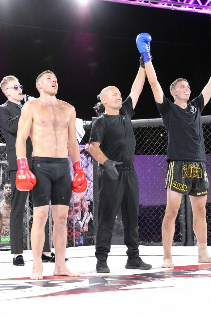 Chris Arena getting his hand raised. Photo credit Ashlee Moreno.