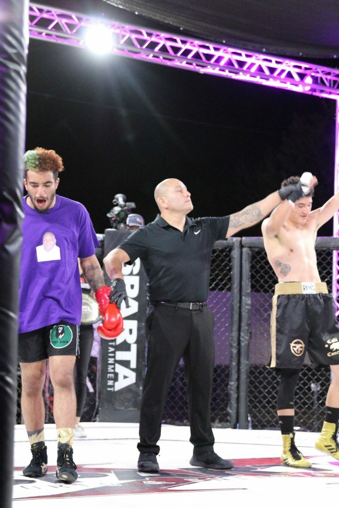 Ramiro Figueroa getting his hand raised. Photo credit Ashlee Moreno.