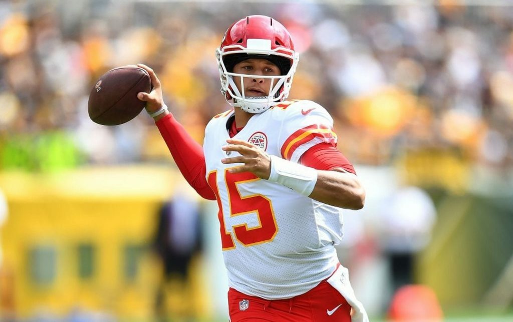 Patrick Mahomes throwing a football.