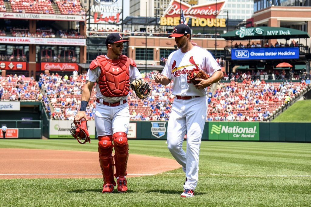 Andrew Knizner and Adam Wainwright walk back to the dugout. Knizner could be the starter in 2021 with Yadi considering free agency