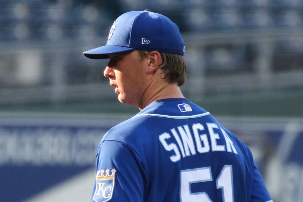 Brady Singer pitching during a spring training game. 