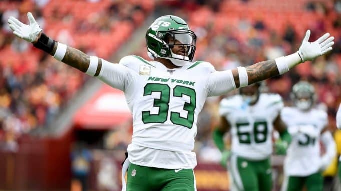 Jamal Adams in green white away Jersey.