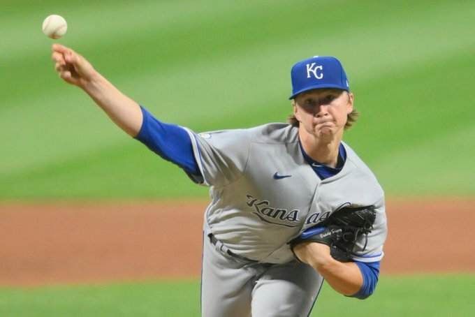Brady Singer pitching.