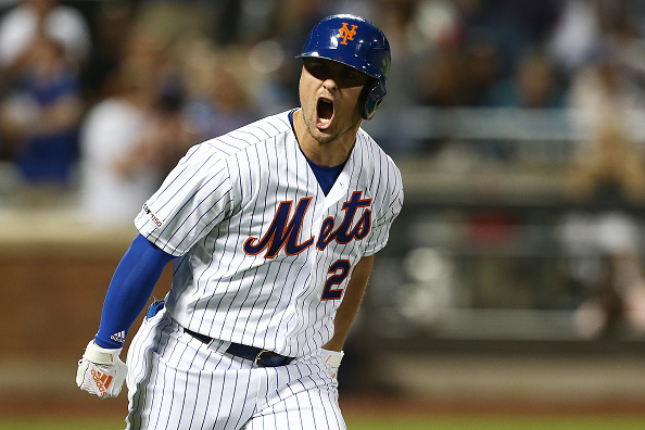 J.D. Davis and Dom Smith react to Luis Guillorme's 22 pitch at-bat