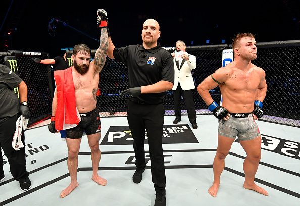 Jimmie Rivera getting his hand raised in victory.