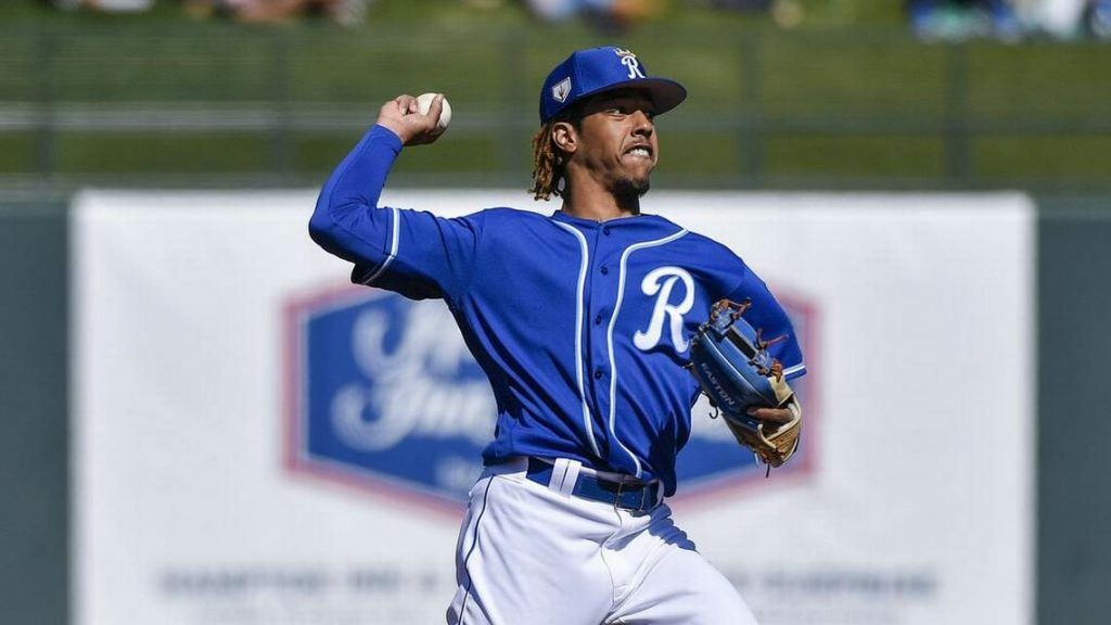 adalberto mondesi throwing a baseball during a spring training game.