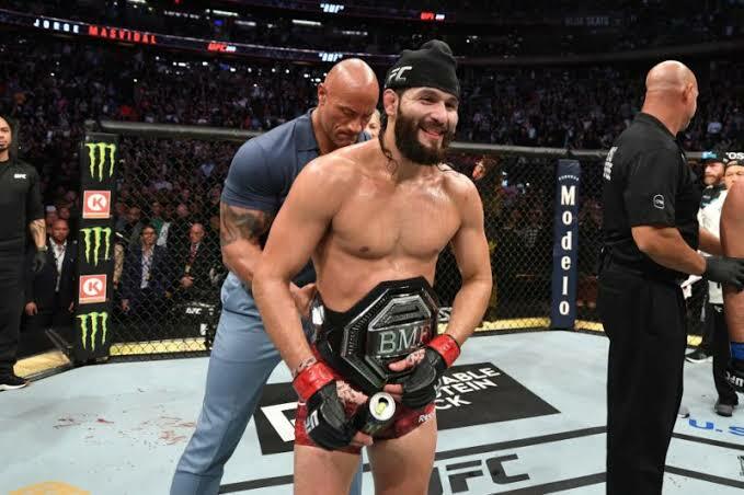 The Rock presenting the BMF belt to Jorge Masvidal at UFC 244