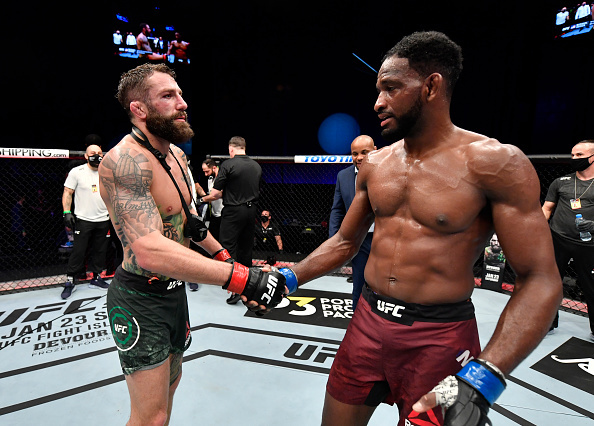 Michael Chiesa and Neil Magny shaking hands
