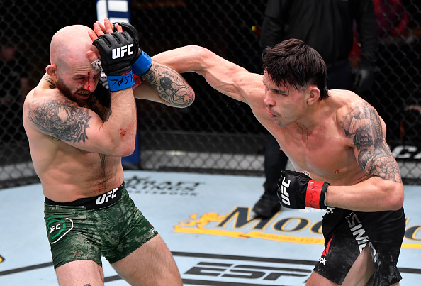 Ricky Simon landing a right hand on Brian Kelleher. UFC 258 takeaways