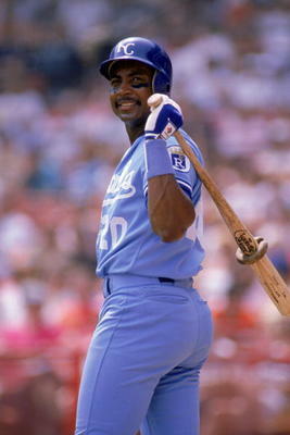 Frank White holding his bat.