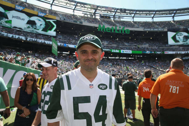 New York Jets fans A.J. (L) and Gary Vaynerchuk await their team's pick  during the first round of the NFL Draft on April 30, 2015 in Chicago. The  Jets selected USC's Leonard