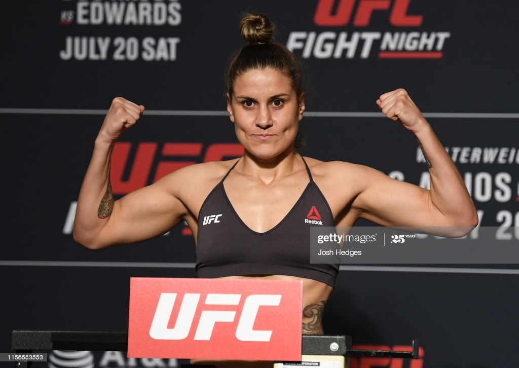 Jennifer Maia flexing. Calderwood vs Maia