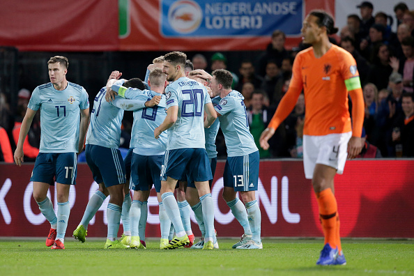 The Northern Ireland squad celebrating a goal in their EURO Qualifier match vs the Netherlands.