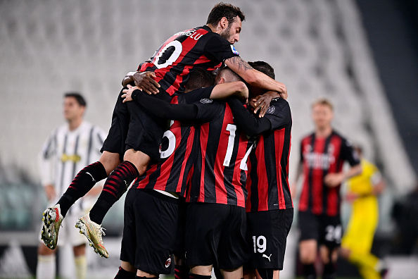 AC Milan celebrate after scoring against Serie A rivals Juventus.