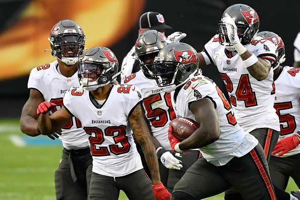 TAMPA, FL - OCTOBER 04: Jordan Whitehead (33) and Devin White (45) of the  Buccaneers celebrates a defensive stop during the regular season game  between the Los Angeles Chargers and the Tampa