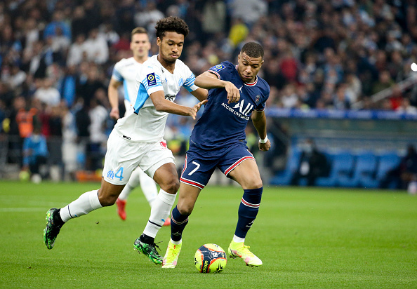New Aston Villa transfer Boubacar Kamara attempting to tackle Ligue 1 rival Kylian Mbappe while playing for old club Olympique Marseille.