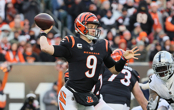 Raiders cornerback Nate Hobbs (39) tackles Cincinnati Bengals quarterback  Joe Burrow (9) after …