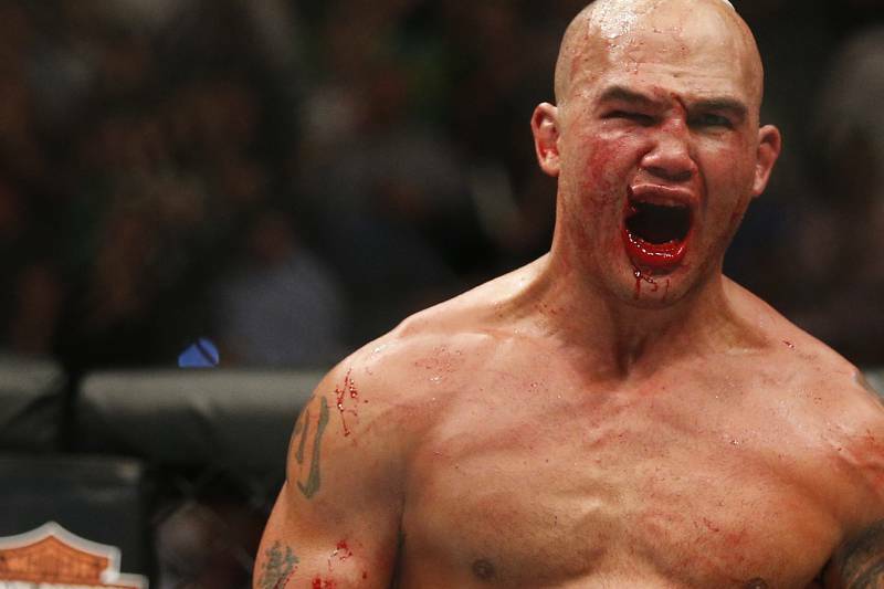 Lawler in the UFC octagon with cut lip