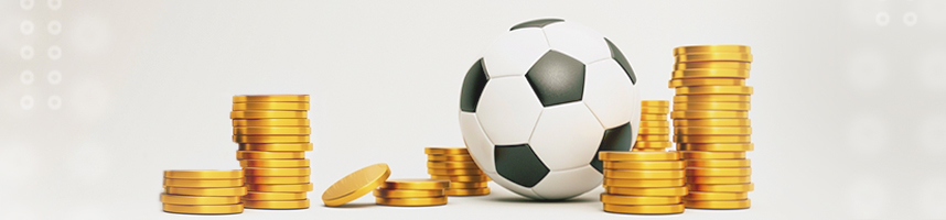 The image shows a soccer ball next to small piles of coins.