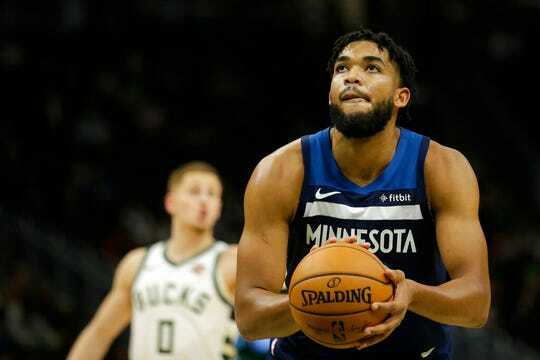 Karl-Anthony Towns shoots a free throw against the Milwaukee Bucks