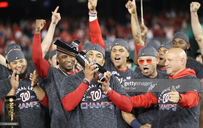 League Championship Series - St Louis Cardinals v Washington Nationals - Game Four
WASHINGTON, DC - OCTOBER 15: General manager Mike Rizzo and Manager Dave Martinez #4 of the Washington Nationals celebrate with the trophy after winning game four and the National League Championship Series against the St. Louis Cardinals at Nationals Park on October 15, 2019 in Washington, DC. (Photo by Rob Carr/Getty Images
