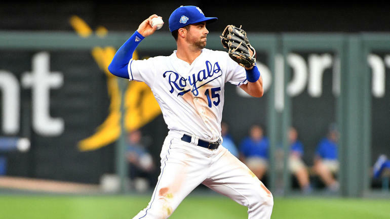 Whit Merrifield throwing a baseball.