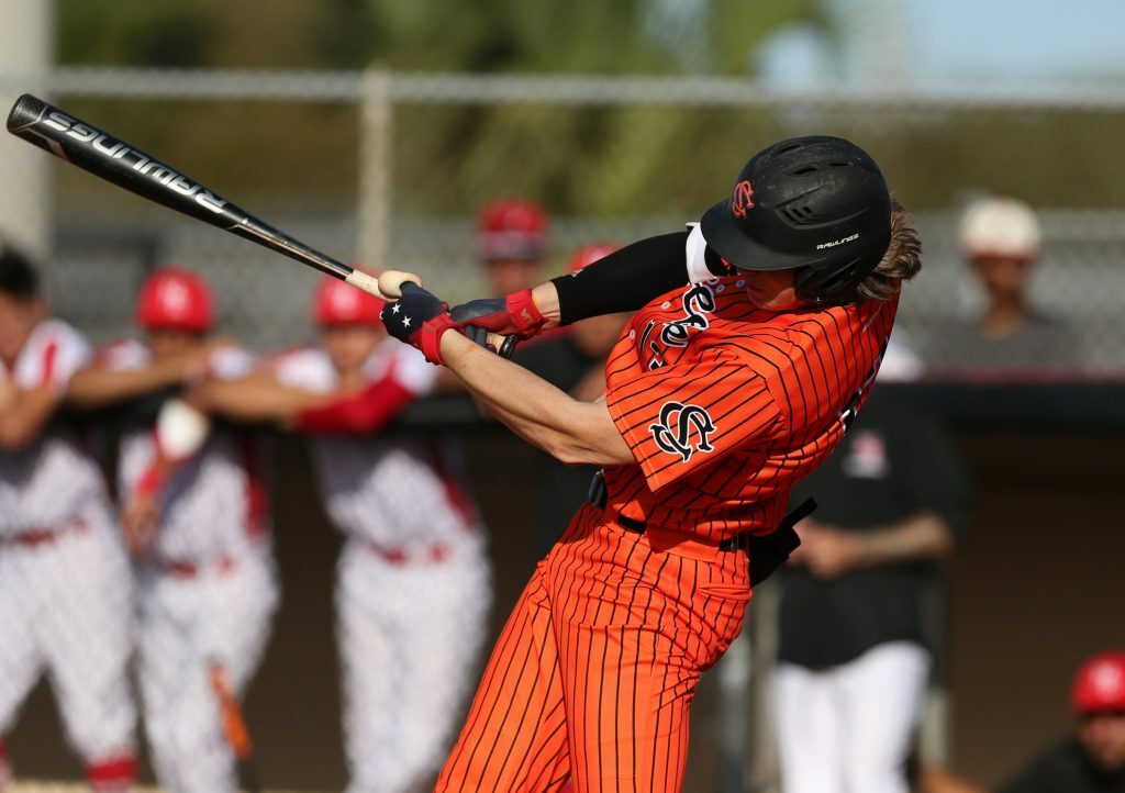 Zac Veen hitting a ball.